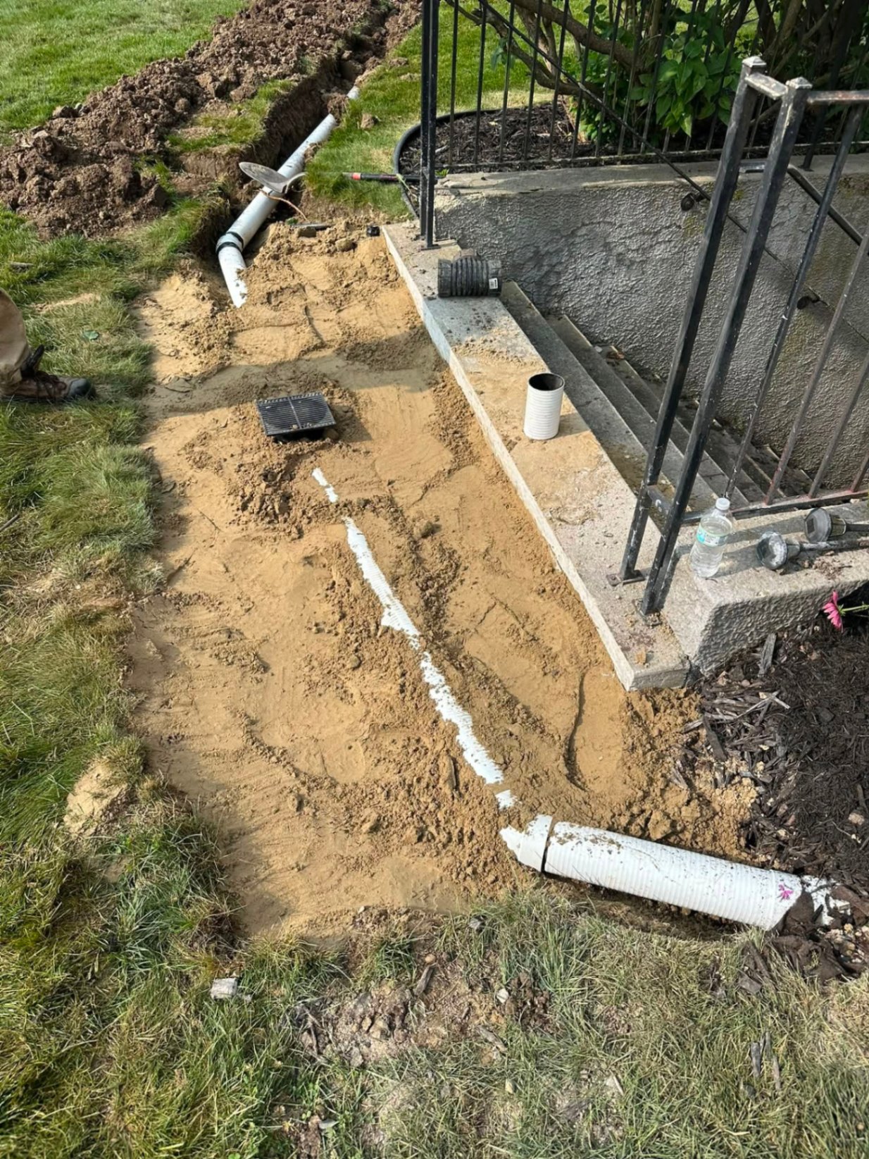 Downspout tie-in & drain basin